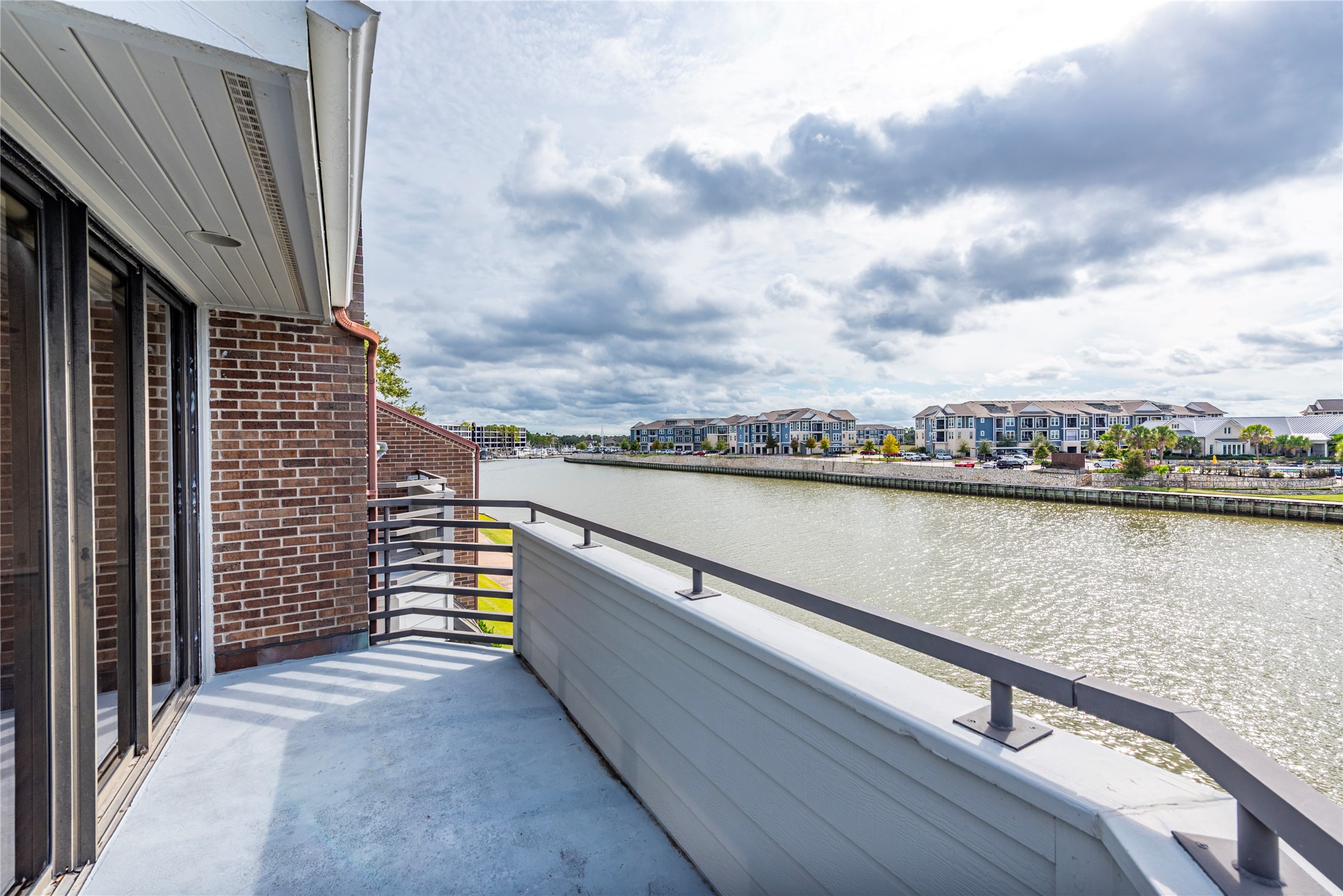 2037 Enterprise Avenue League City, TX 77573 - Photo 31 of 49 a view of swimming pool with outdoor seating and lake