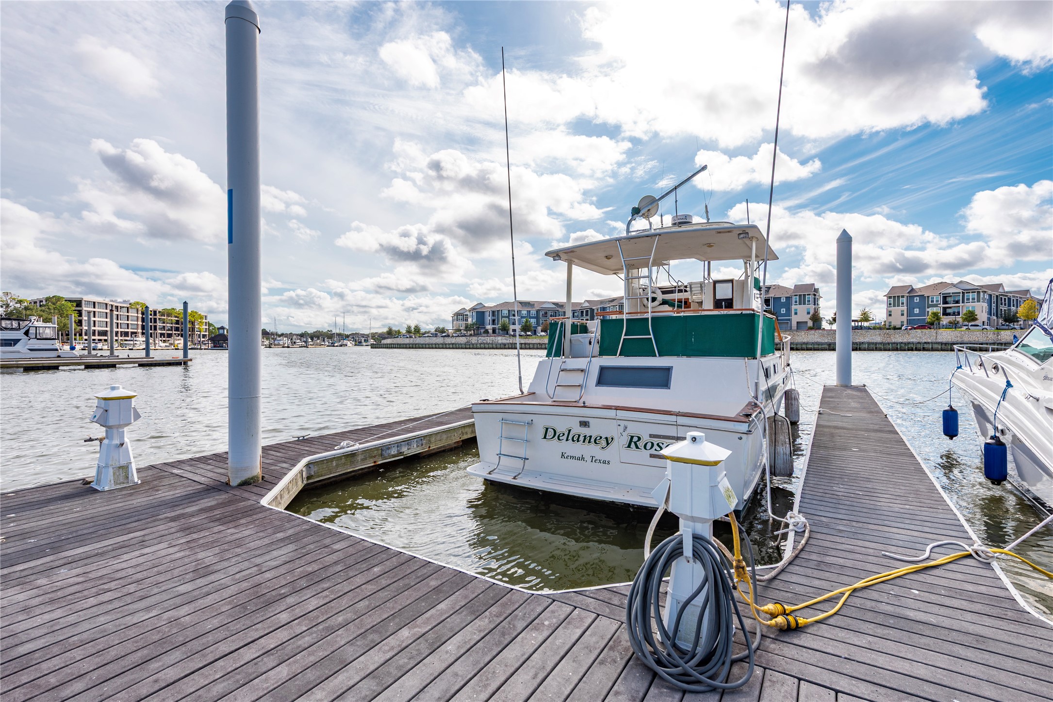 2037 Enterprise Avenue League City, TX 77573 - Photo 42 of 49 a view of a balcony with wooden floor and outdoor seating