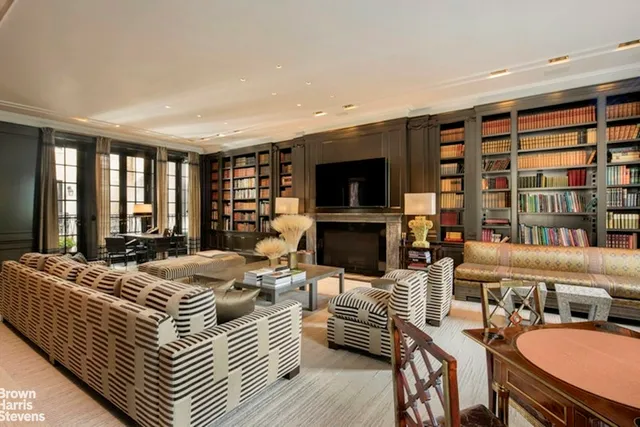 a bedroom with furniture and a flat screen tv