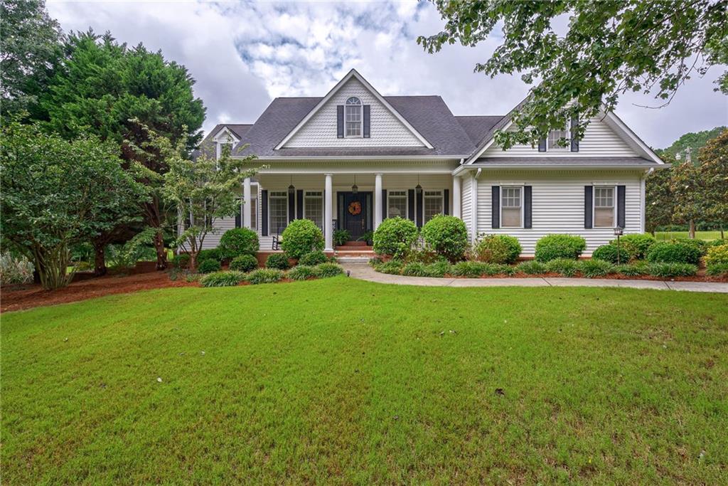 2453 Whitney Road Monroe, GA 30655 - Photo 1 of 1 a front view of house with yard and green space