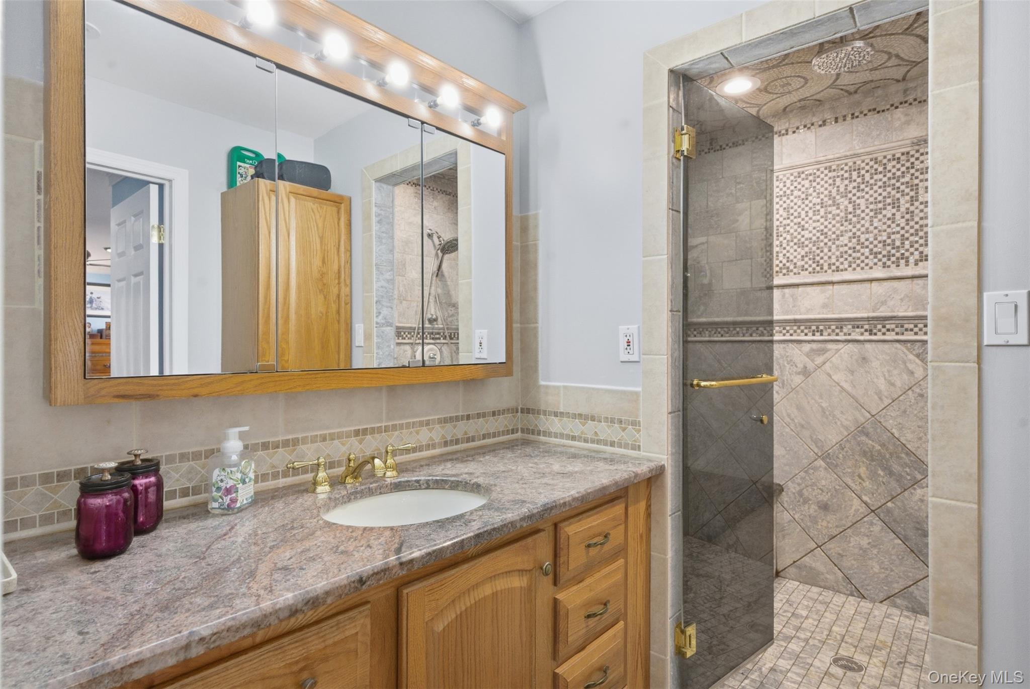 1285 Lakes Road Monroe, NY 10950 - Photo 22 of 45 a bathroom with a granite countertop sink and a mirror