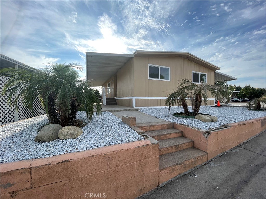 34111 Wildwood Canyon Road, Unit 33 Yucaipa, CA 92399 - Photo 1 of 1 a house view with a outdoor space
