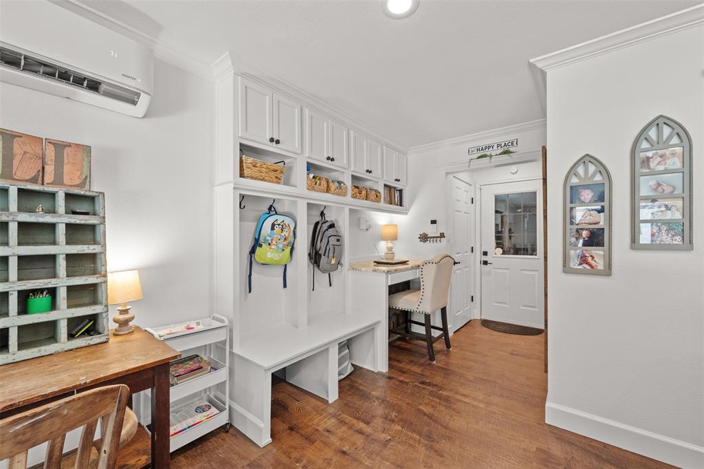 3050 Bosque Ridge Road Crawford, TX 76638 - Photo 24 of 40 a view of a workspace with furniture and wooden floor