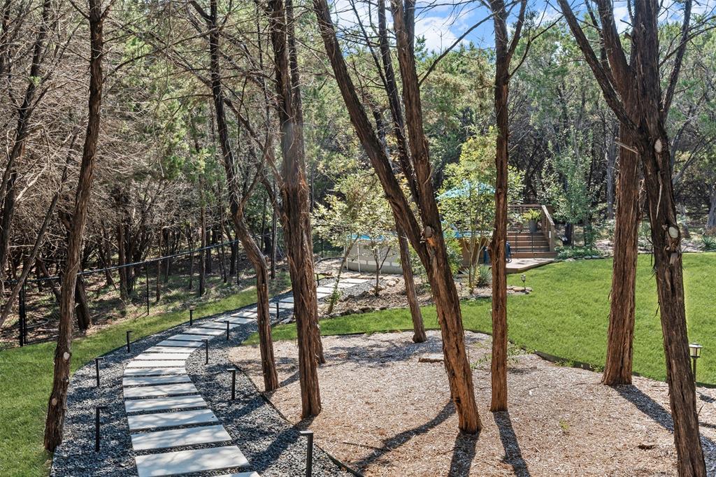 3050 Bosque Ridge Road Crawford, TX 76638 - Photo 34 of 40 a view of a yard with large trees
