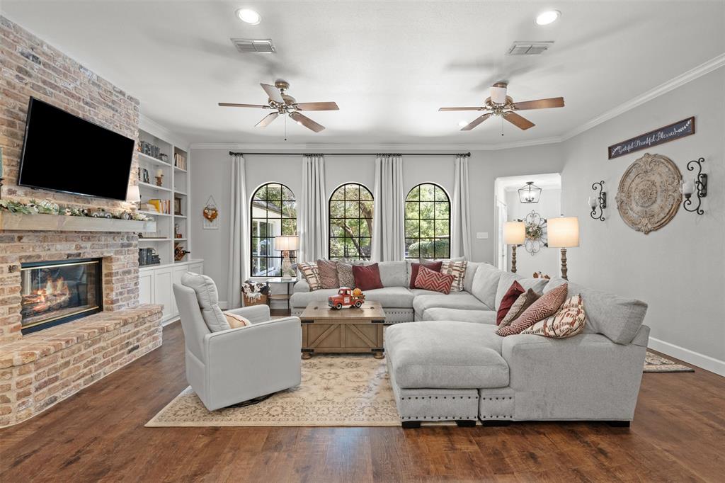 3050 Bosque Ridge Road Crawford, TX 76638 - Photo 9 of 40 a living room with fireplace furniture and a flat screen tv