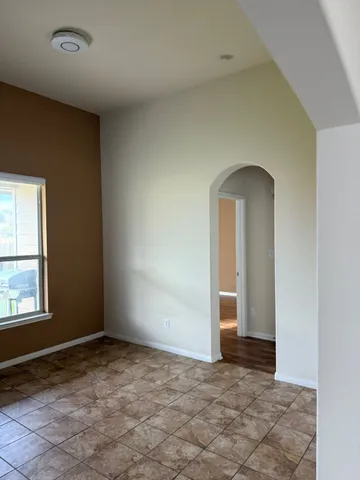 a view of an empty room and window