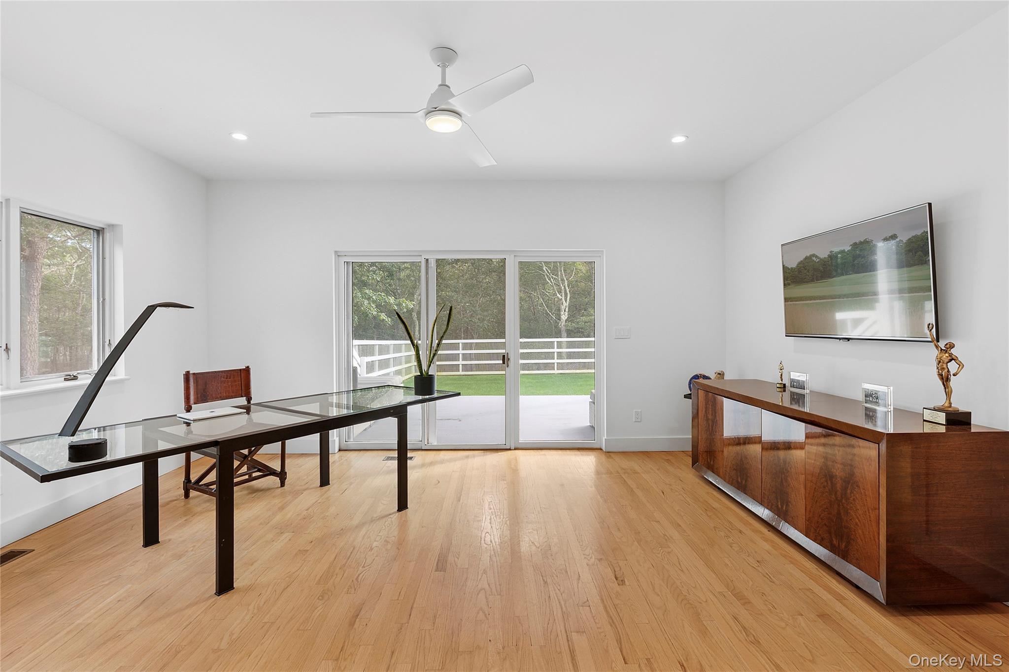 198 2 Holes Water Road East Hampton, NY 11937 - Photo 14 of 25 a living room with furniture and a wooden floor