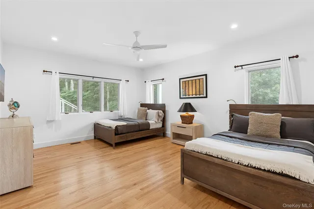 a spacious bedroom with a bed and window