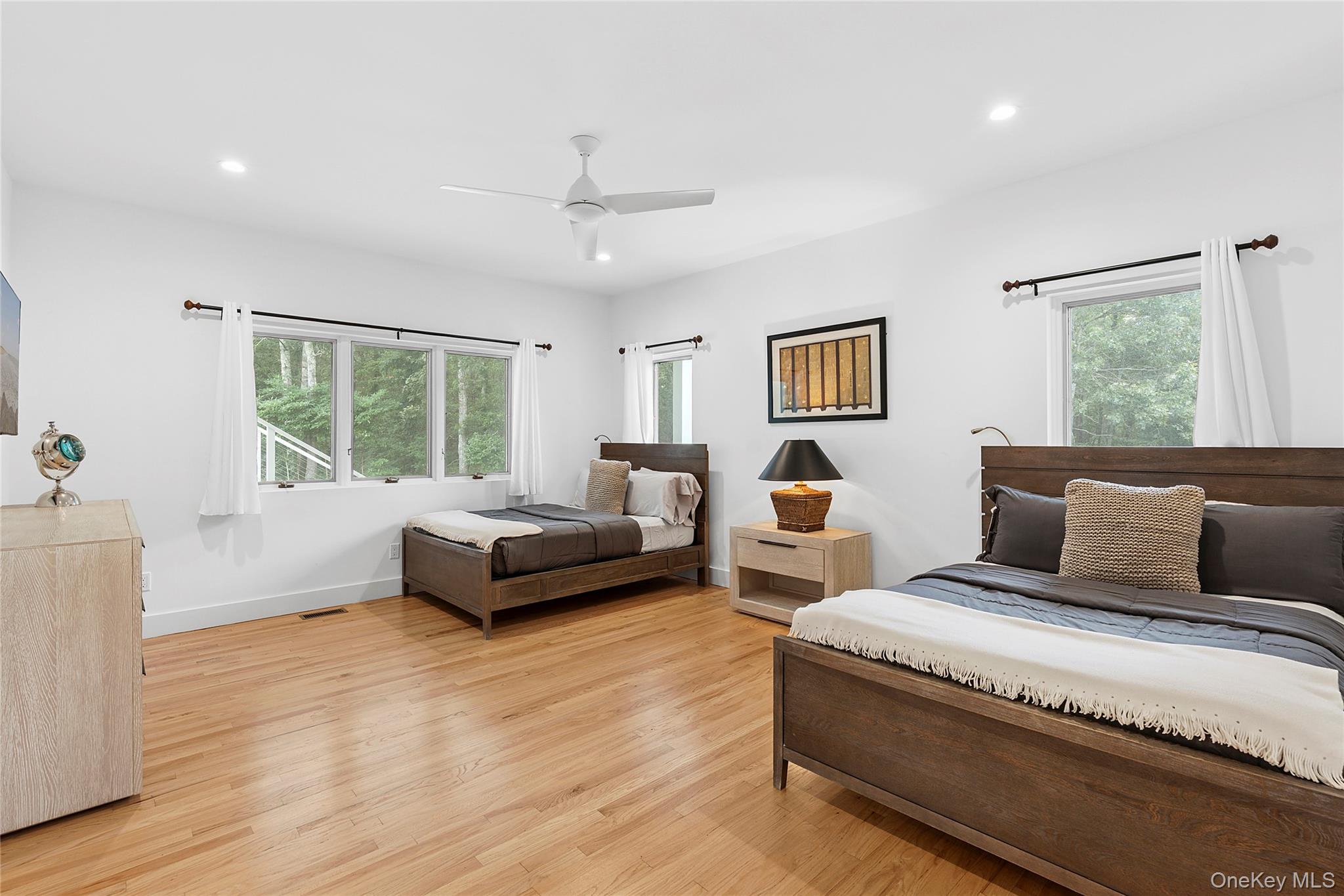 198 2 Holes Water Road East Hampton, NY 11937 - Photo 19 of 25 a spacious bedroom with a bed and window