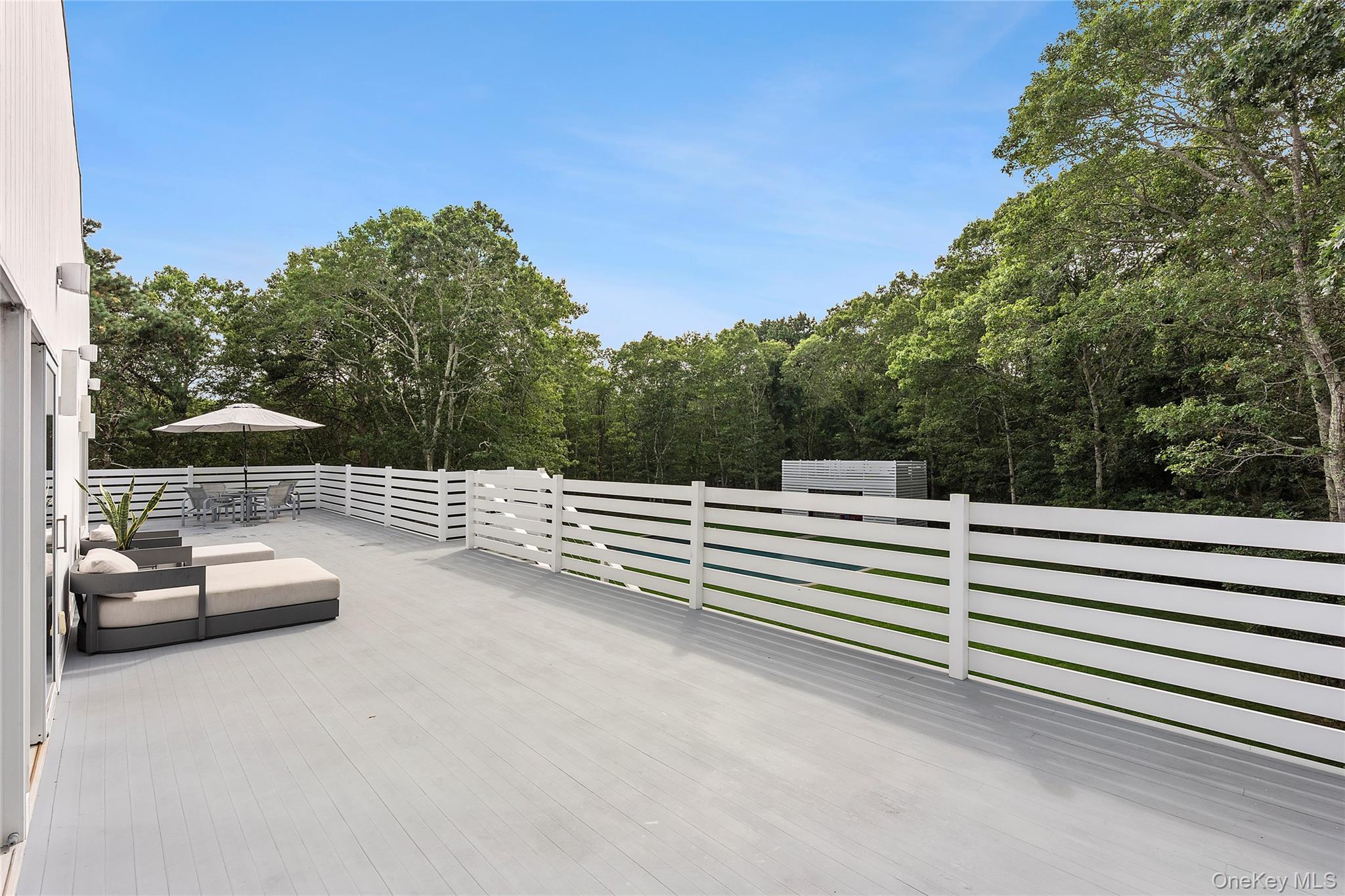 198 2 Holes Water Road East Hampton, NY 11937 - Photo 6 of 25 a view of a terrace with yard