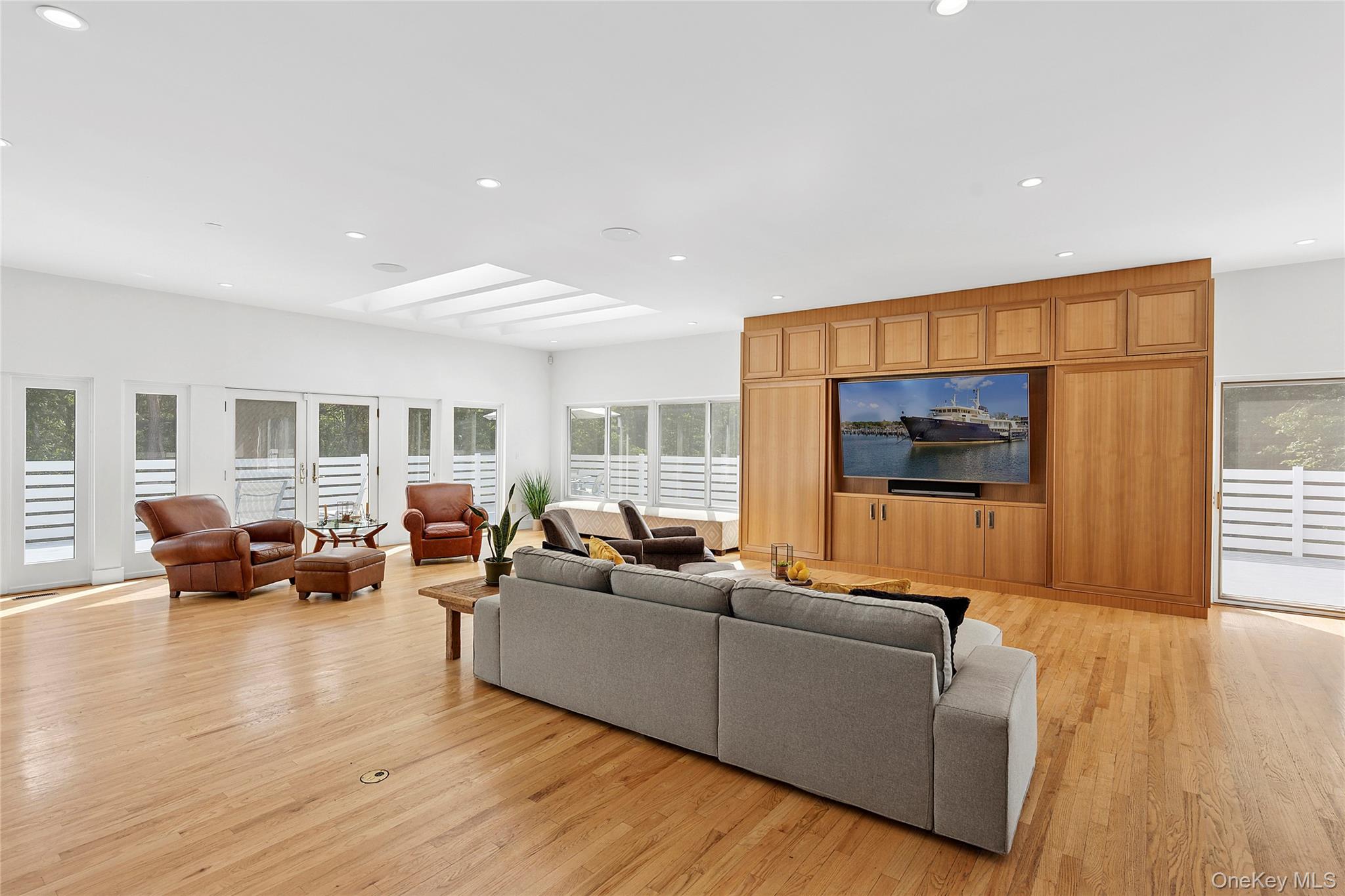 198 2 Holes Water Road East Hampton, NY 11937 - Photo 9 of 25 a living room with furniture and wooden floor