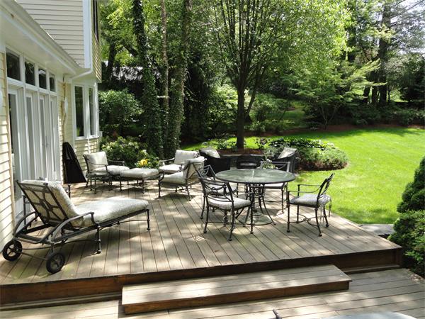 401 Dudley Road Newton, MA 02459 - Photo 12 of 16 a view of a patio with table and chairs and potted plants