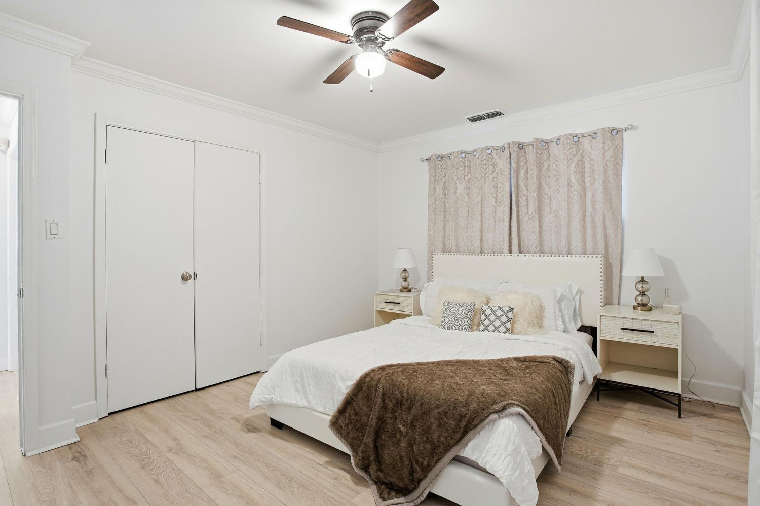 3801 Woodcrest Road Sacramento, CA 95821 - Photo 15 of 35 a bedroom with a bed and a ceiling fan