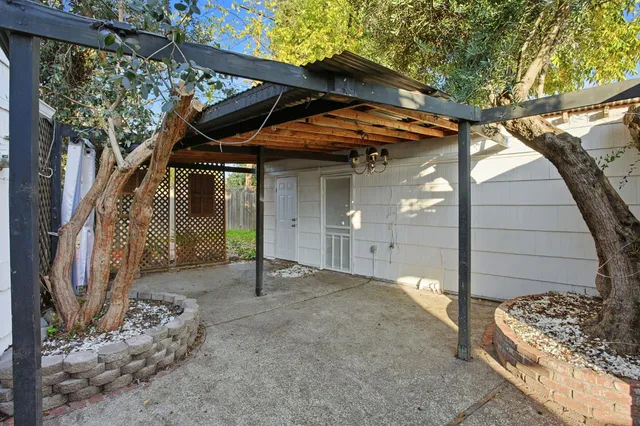 a view of a house with a tree