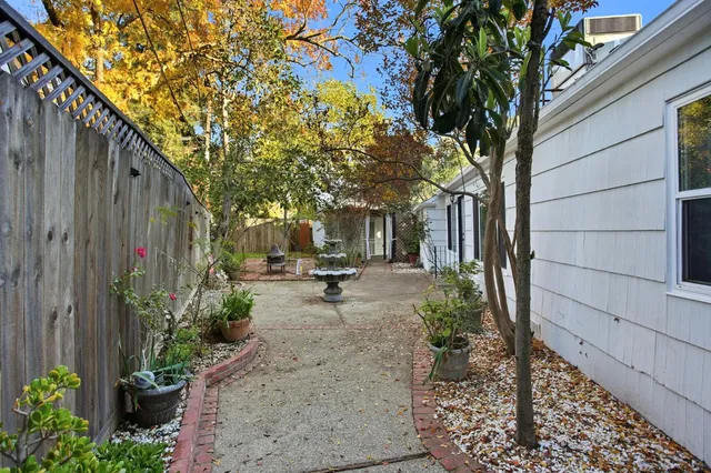 a view of a backyard with sitting area