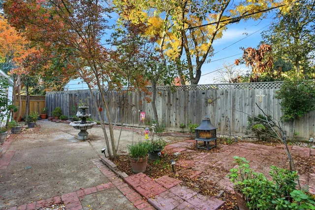 a view of outdoor space with seating area and trees