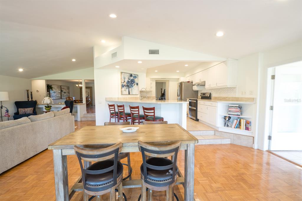 3300 Southwest 62nd Lane Gainesville, FL 32608 - Photo 25 of 34 a large kitchen with a table and chairs