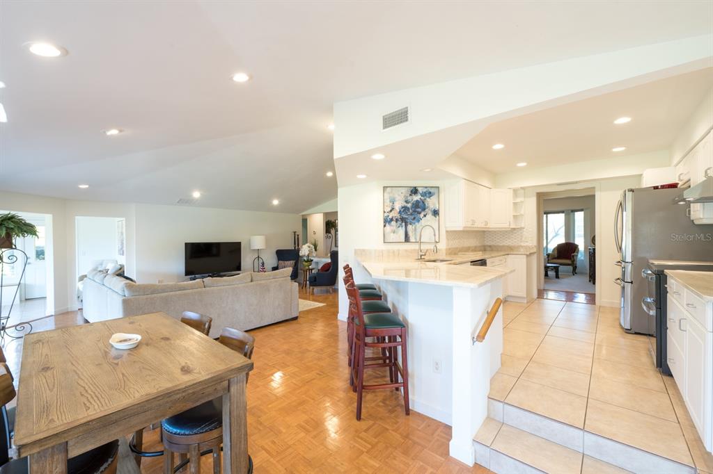 3300 Southwest 62nd Lane Gainesville, FL 32608 - Photo 26 of 34 a large kitchen with a table and chairs