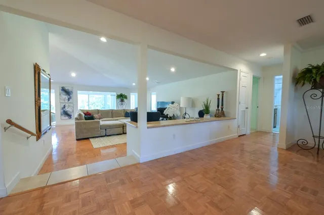 a view of a living room and kitchen