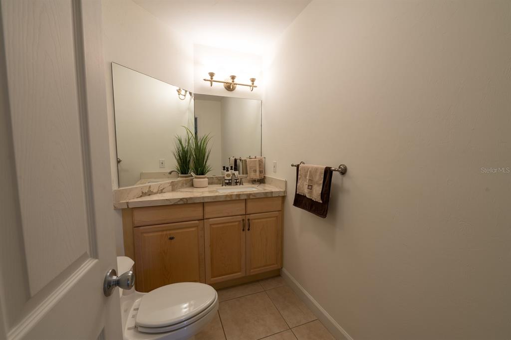 3300 Southwest 62nd Lane Gainesville, FL 32608 - Photo 31 of 34 a bathroom with a toilet sink and mirror