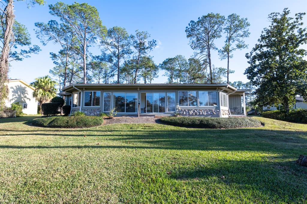 3300 Southwest 62nd Lane Gainesville, FL 32608 - Photo 33 of 34 a front view of a house with a garden