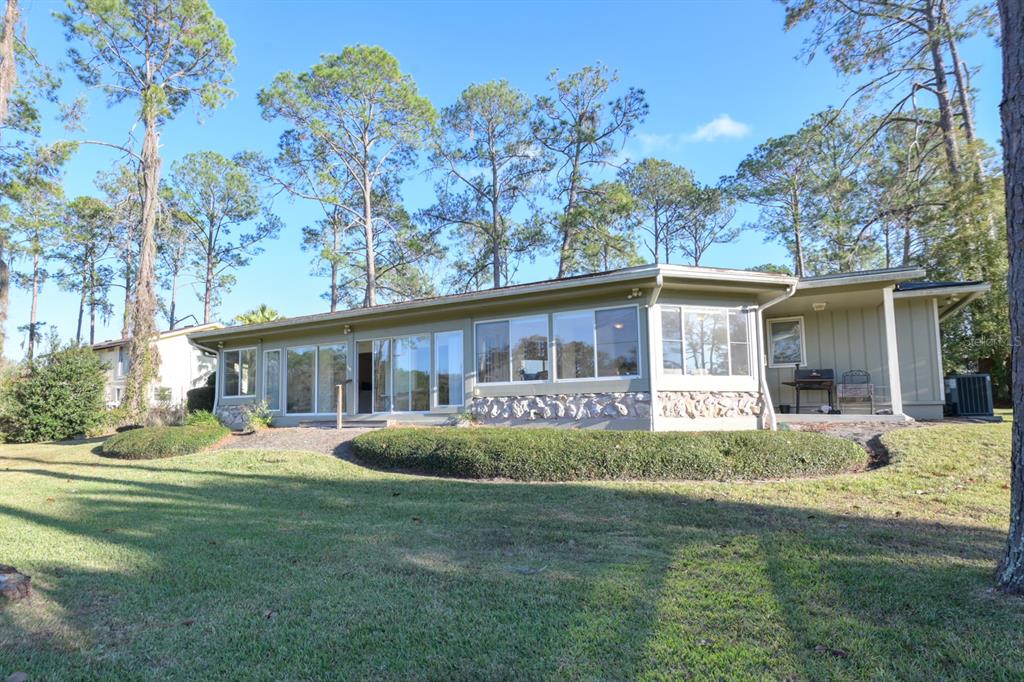 3300 Southwest 62nd Lane Gainesville, FL 32608 - Photo 34 of 34 a front view of house with yard outdoor seating and green space