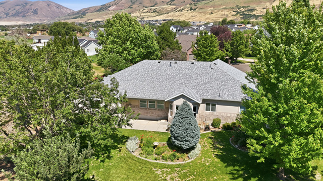 2190 750 West Perry, UT 84302 - Photo 40 of 42 Ranch-style residence featuring a gray shingle roof and a combination of beige siding and stone facade