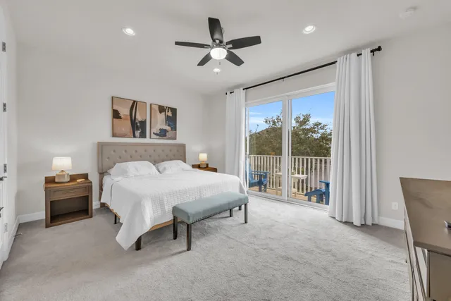 a spacious bedroom with a bed and a large window