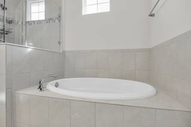 a white bath tub sitting in a bathroom