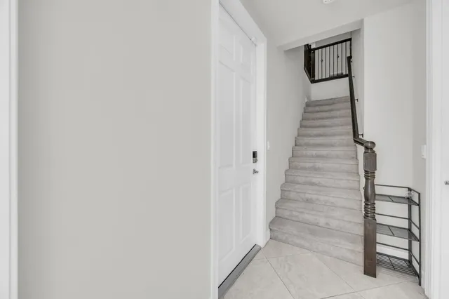 a view of a hallway with staircase