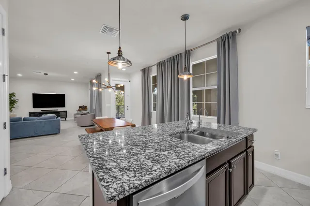 a view of a kitchen with granite countertop living room and living room