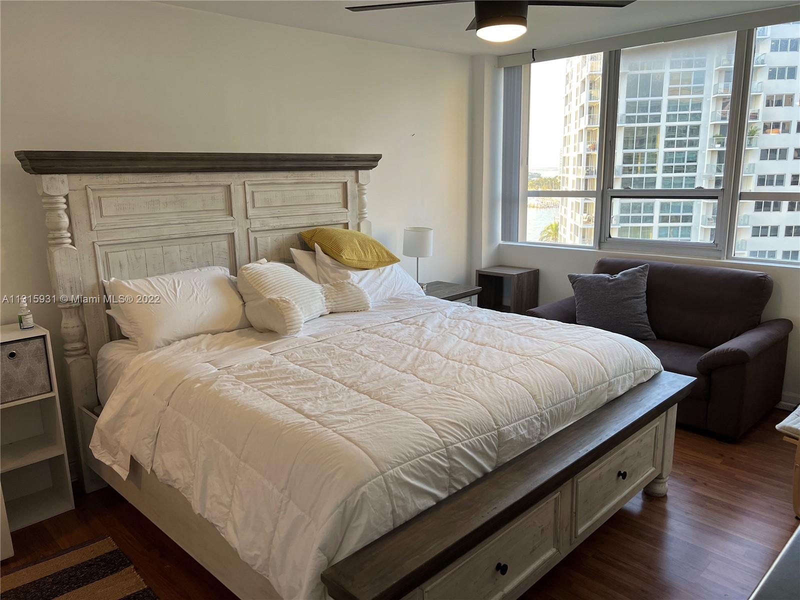 1500 Bay Road, Unit 944S Miami Beach, FL 33139 - Photo 17 of 82 a bedroom with a bed and window