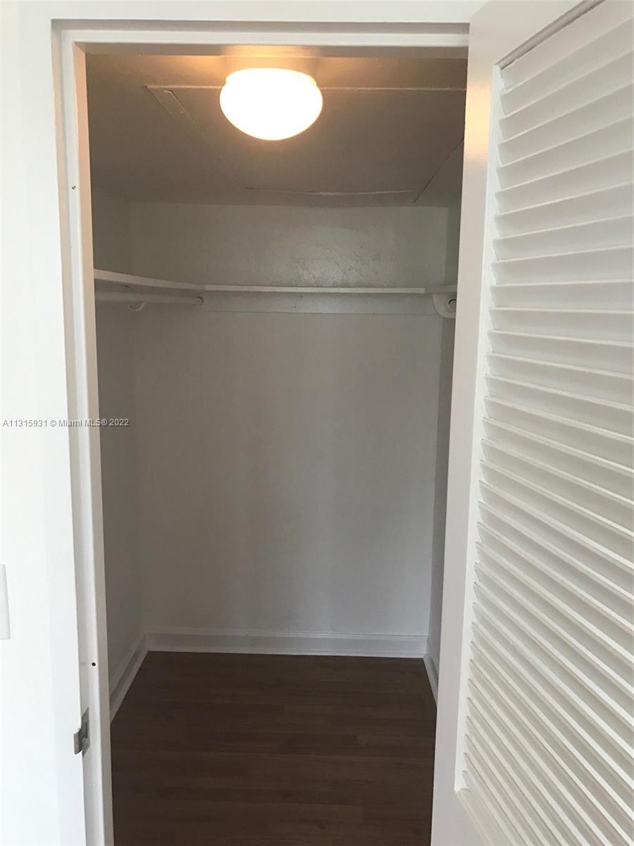 1500 Bay Road, Unit 944S Miami Beach, FL 33139 - Photo 21 of 82 a view of a closet with wooden floor
