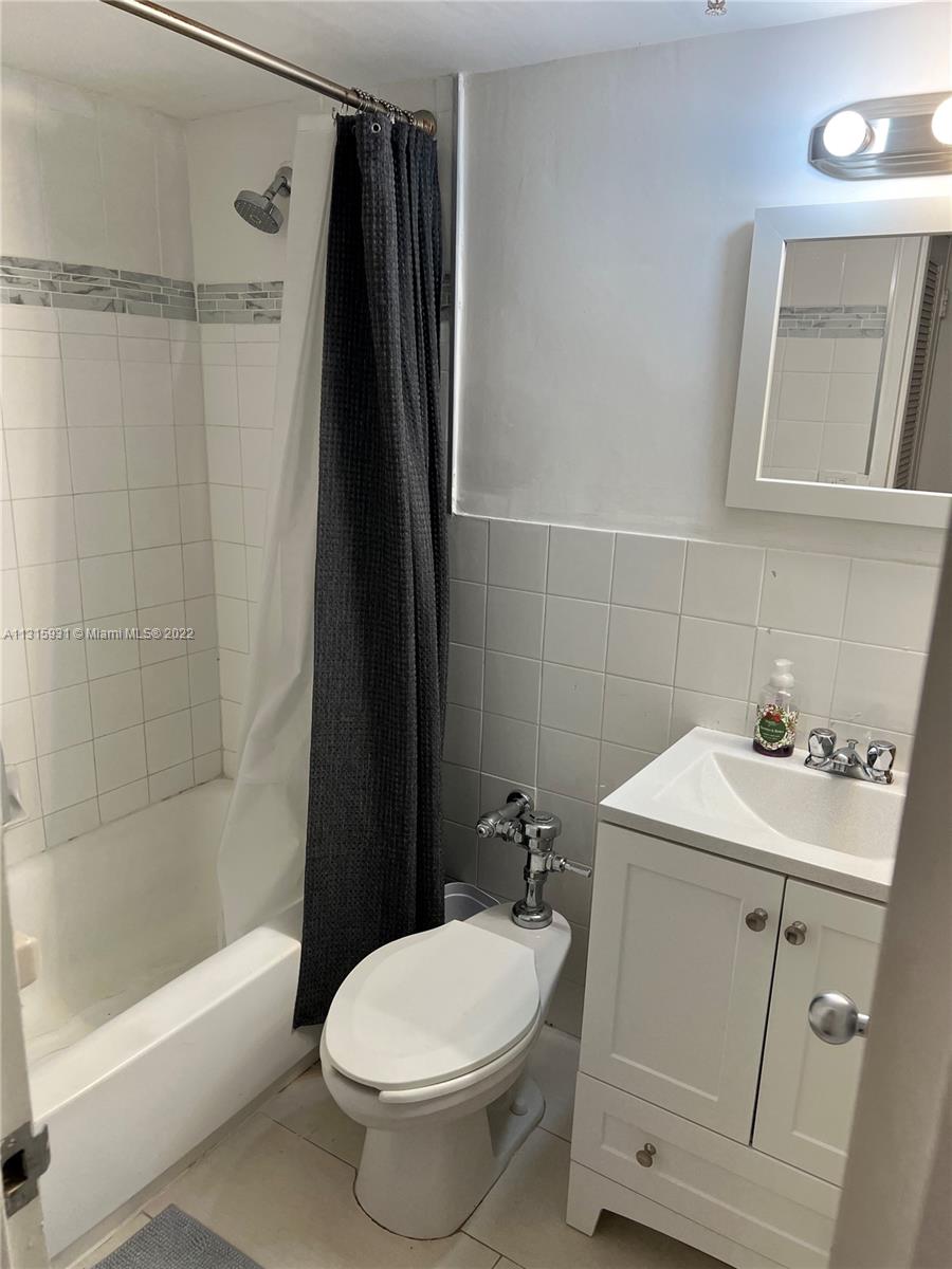 1500 Bay Road, Unit 944S Miami Beach, FL 33139 - Photo 27 of 82 a bathroom with a sink toilet and shower