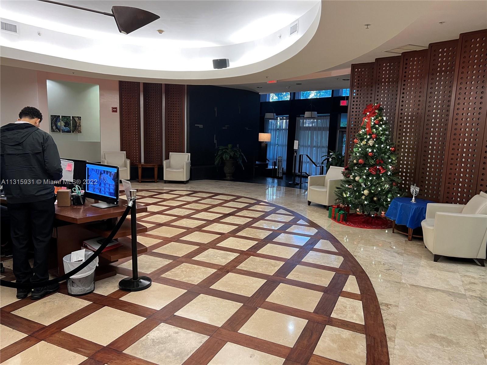 1500 Bay Road, Unit 944S Miami Beach, FL 33139 - Photo 36 of 82 a living room with furniture and a potted plant