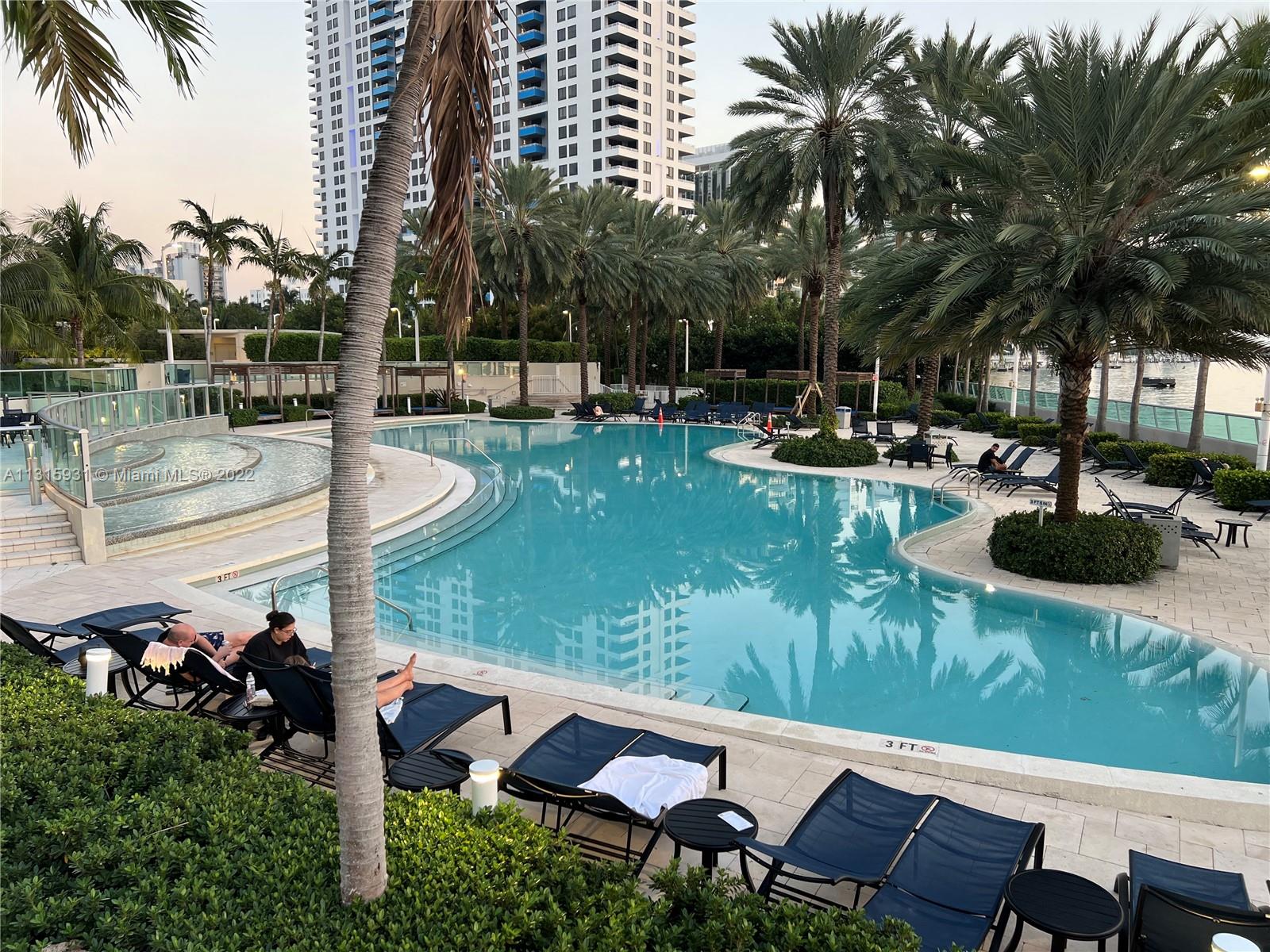 1500 Bay Road, Unit 944S Miami Beach, FL 33139 - Photo 46 of 82 a view of a garden with sitting area