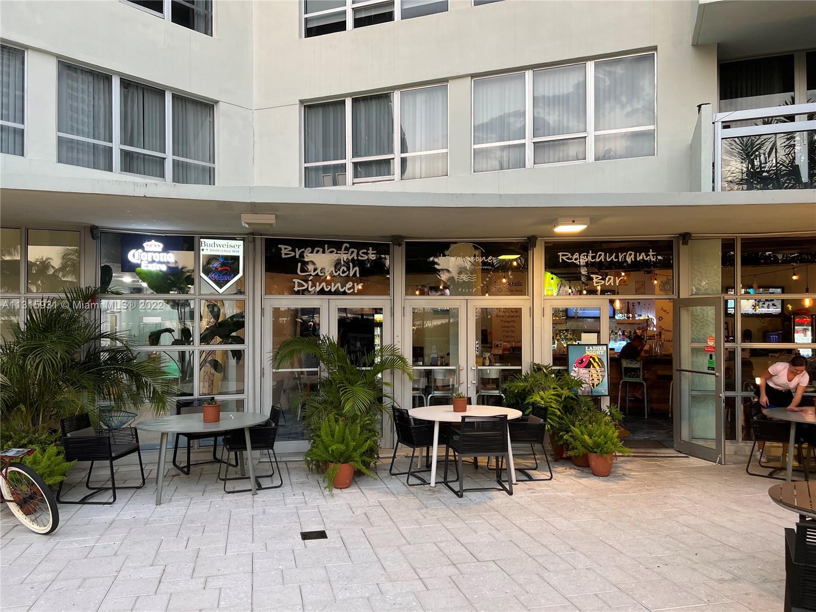 1500 Bay Road, Unit 944S Miami Beach, FL 33139 - Photo 52 of 82 a view of work place with a table and chairs and potted plants