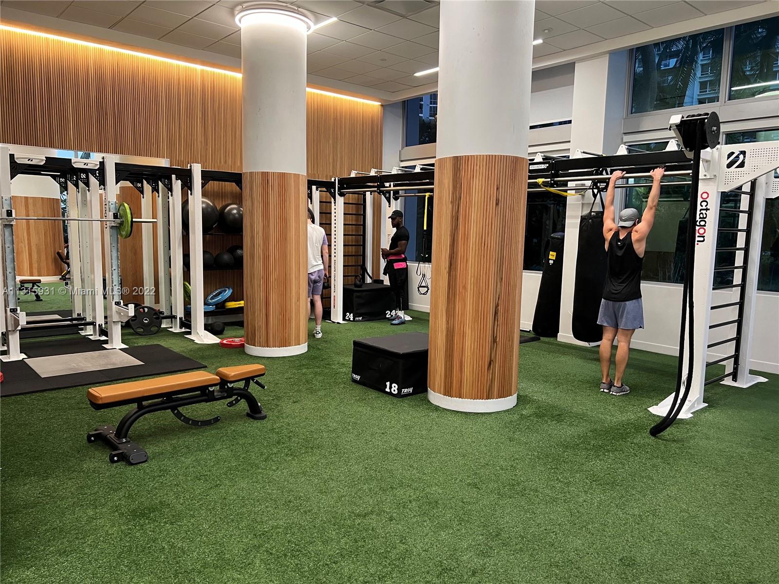 1500 Bay Road, Unit 944S Miami Beach, FL 33139 - Photo 62 of 82 a room with lots of gym equipment