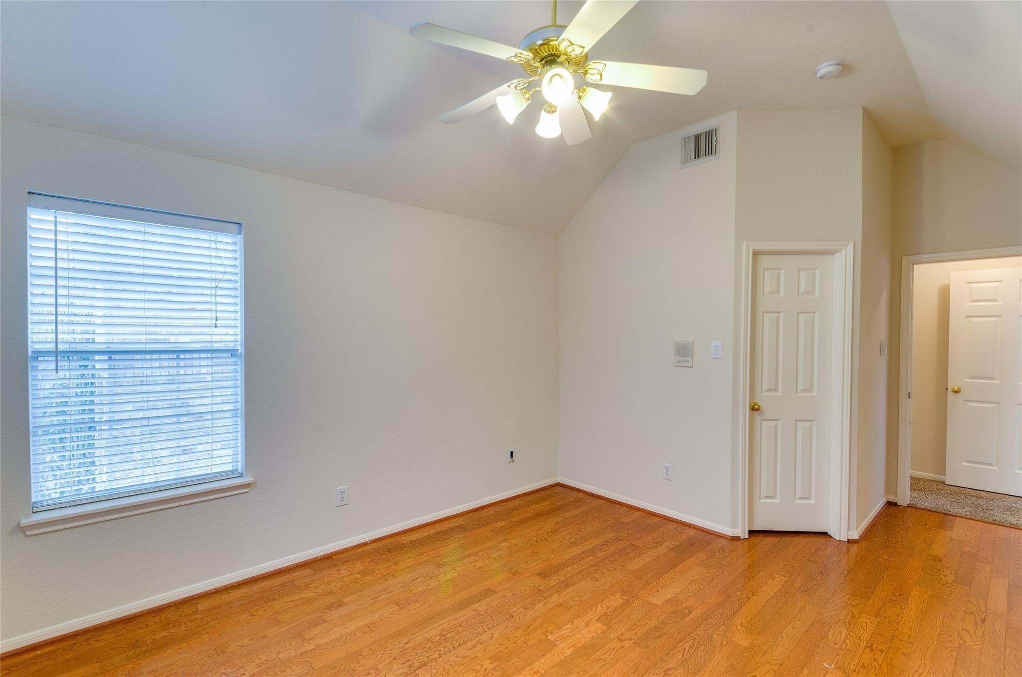 4019 Angel Spring Drive Sugar Land, TX 77479 - Photo 41 of 50 an empty room with a window and a fan