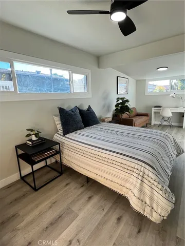 a bedroom with double bed and a window