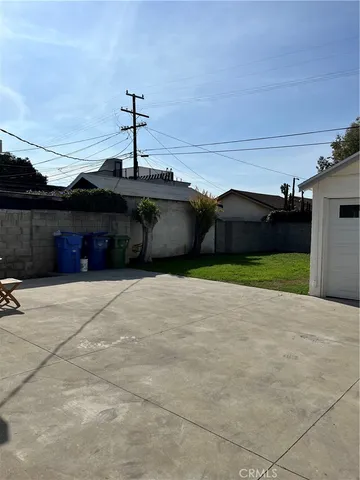 a front view of a house with a yard and a garage