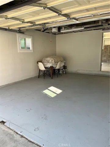 a view of a room with a chair and table