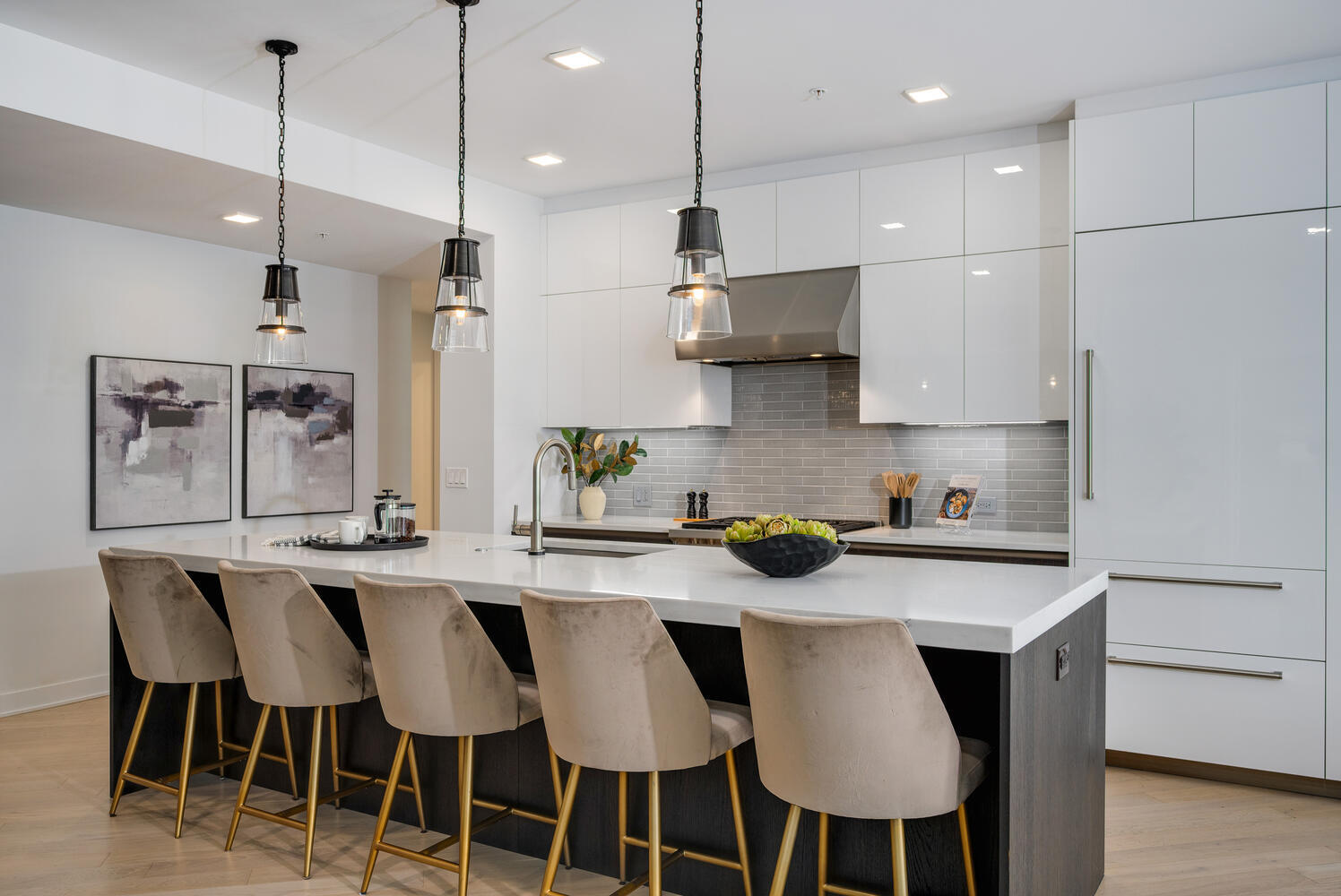 1000 West Monroe Street, Unit 502 Chicago, IL 60607 - Photo 12 of 29 a kitchen with stainless steel appliances granite countertop a table chairs refrigerator and microwave