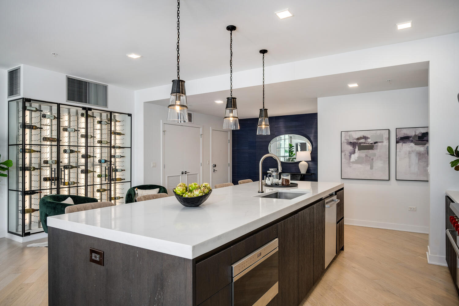 1000 West Monroe Street, Unit 502 Chicago, IL 60607 - Photo 13 of 29 a kitchen with a sink a counter and chairs