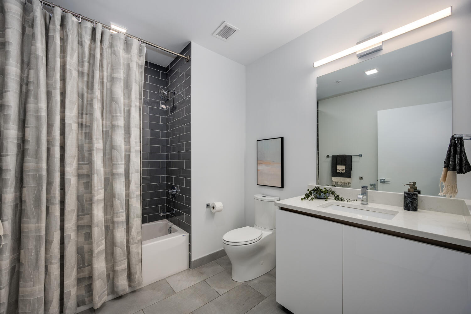 1000 West Monroe Street, Unit 502 Chicago, IL 60607 - Photo 27 of 29 a bathroom with a double vanity sink toilet and shower