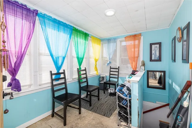 a view of a livingroom with furniture and a window