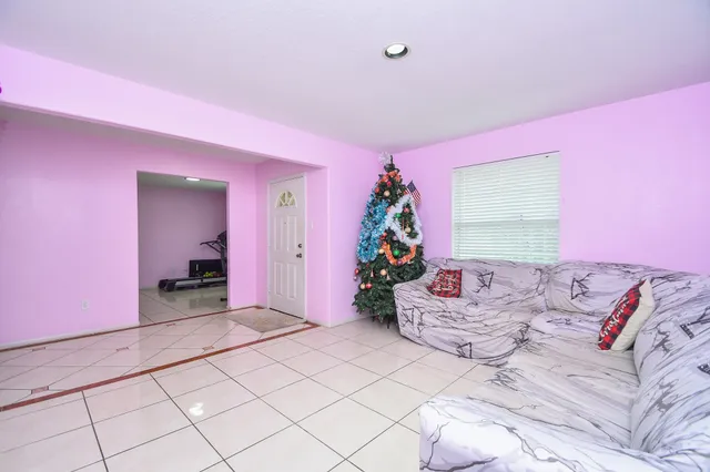 a bed room with a bed and a chair