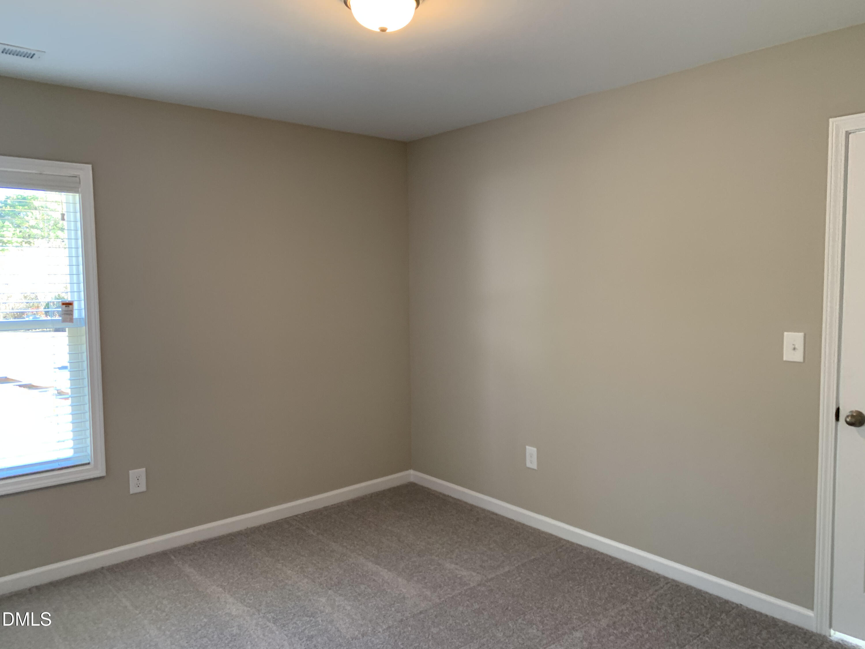 48 Weathervane Dr. Zebulon, NC 27597 - Photo 10 of 24 an empty room with a window