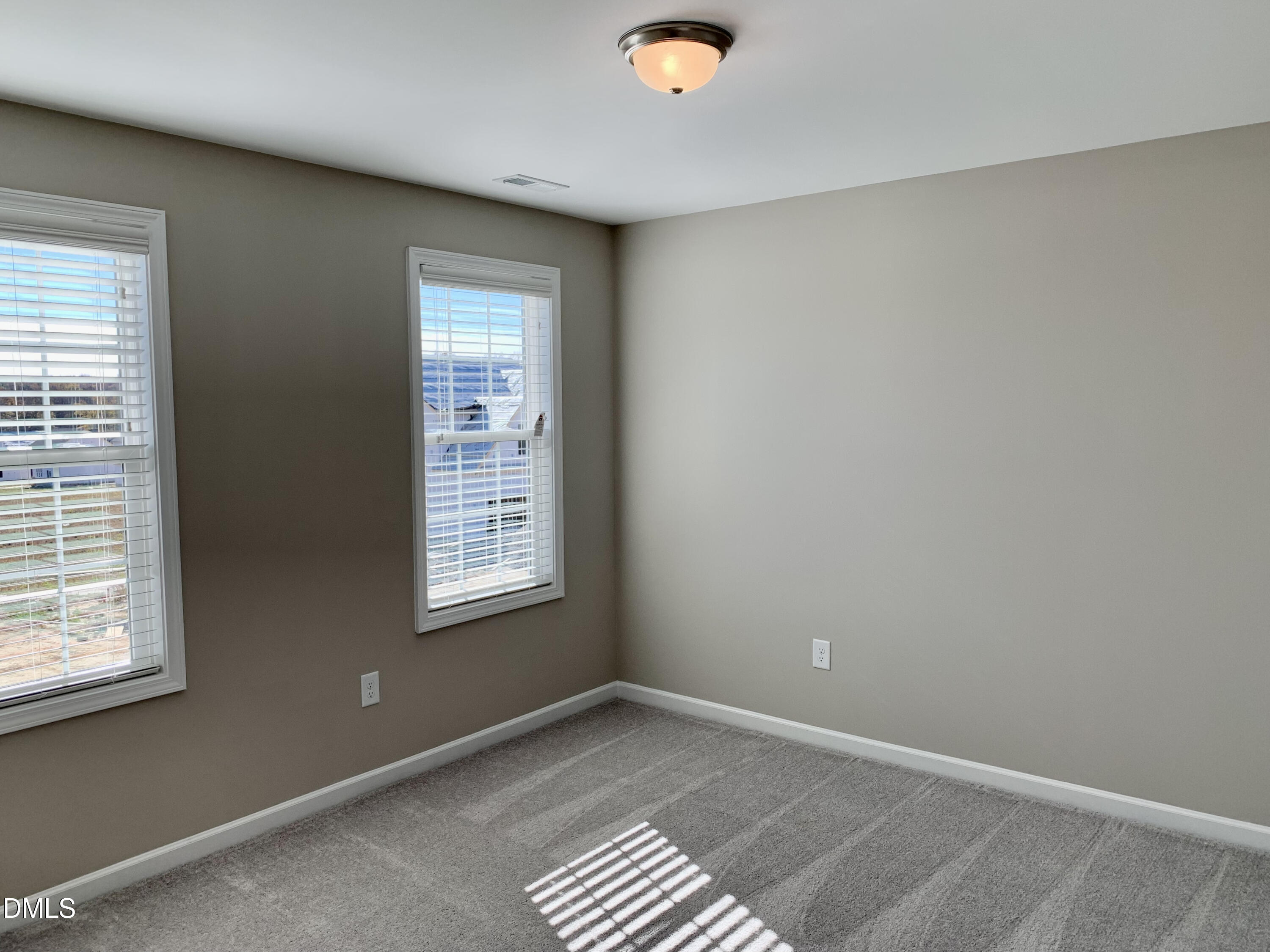 48 Weathervane Dr. Zebulon, NC 27597 - Photo 12 of 24 an empty room with windows