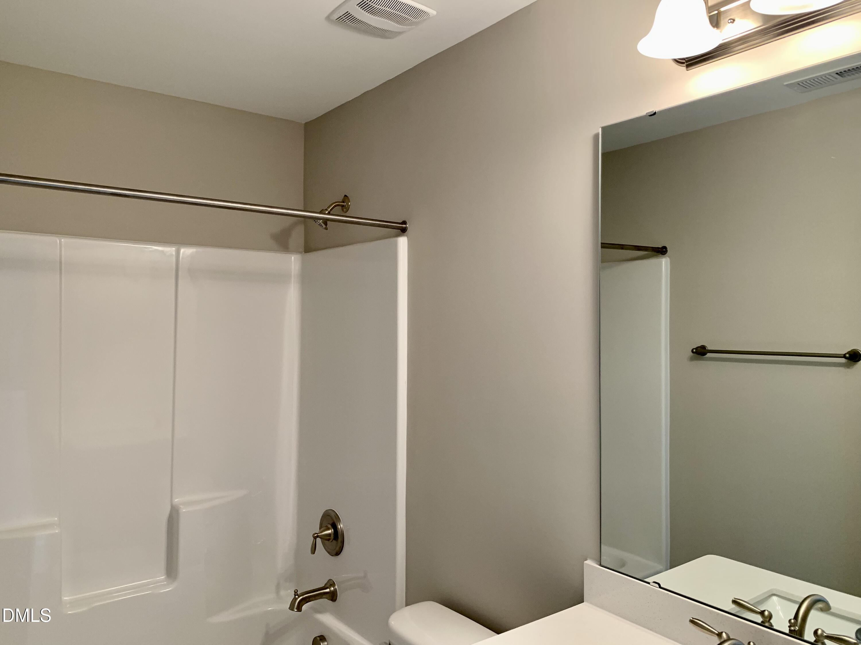 48 Weathervane Dr. Zebulon, NC 27597 - Photo 14 of 24 a bathroom with a shower and a toilet